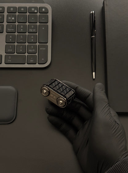 Tank Roller placed on a desk beside a keyboard and notebook, illustrating its use in a work environment.