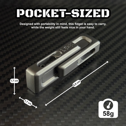 xLock Tower Fidget placed on a desk with a keyboard and notebook, depicting its discreet presence in a professional environment.​