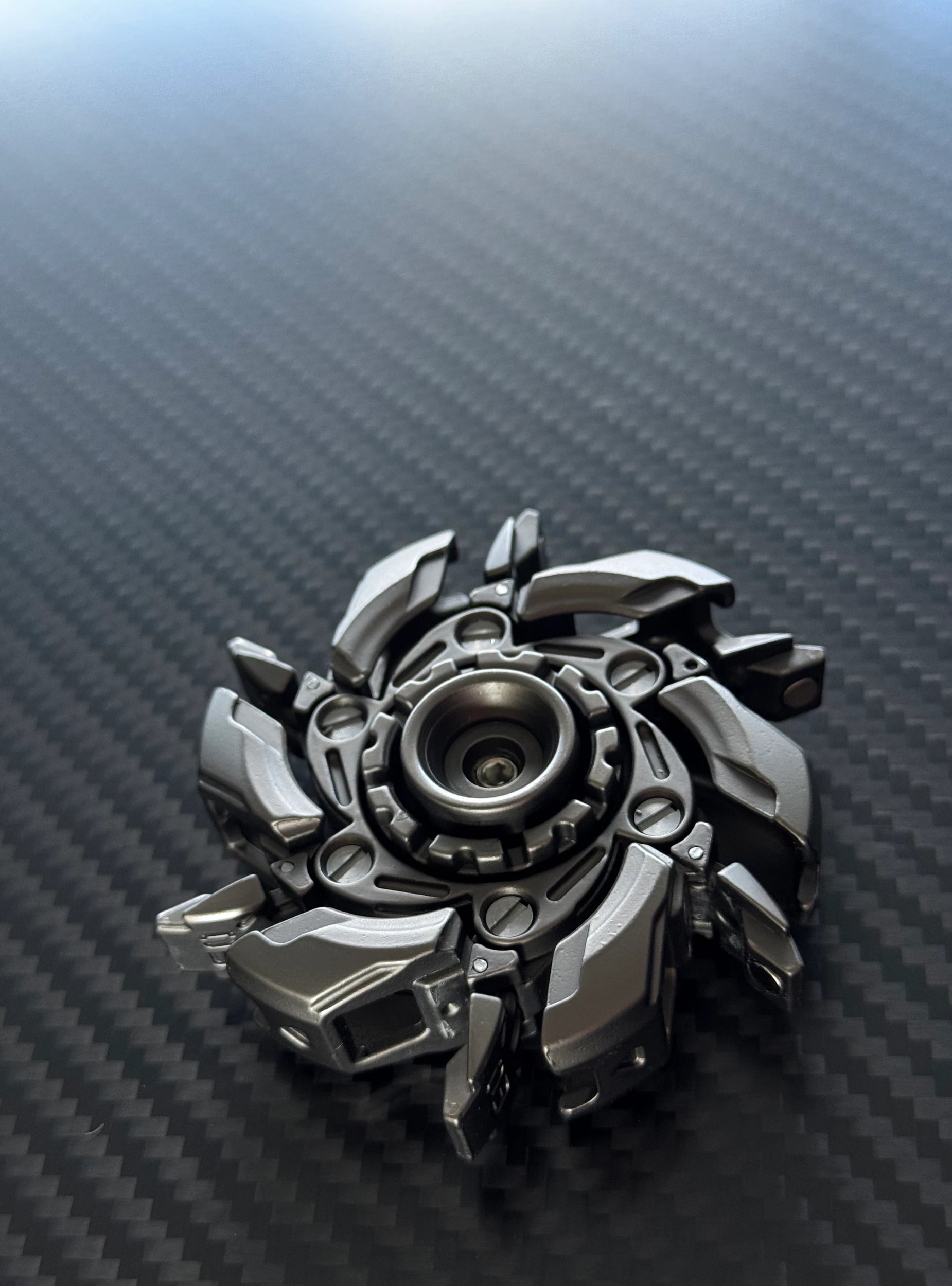 Compact spinner shown near a pocket or bag, demonstrating its portability for on-the-go stress relief
